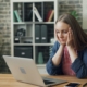 This is a photo of someone looking really stressed to demonstrate 'What’s Slowing Down Your Property Move?'